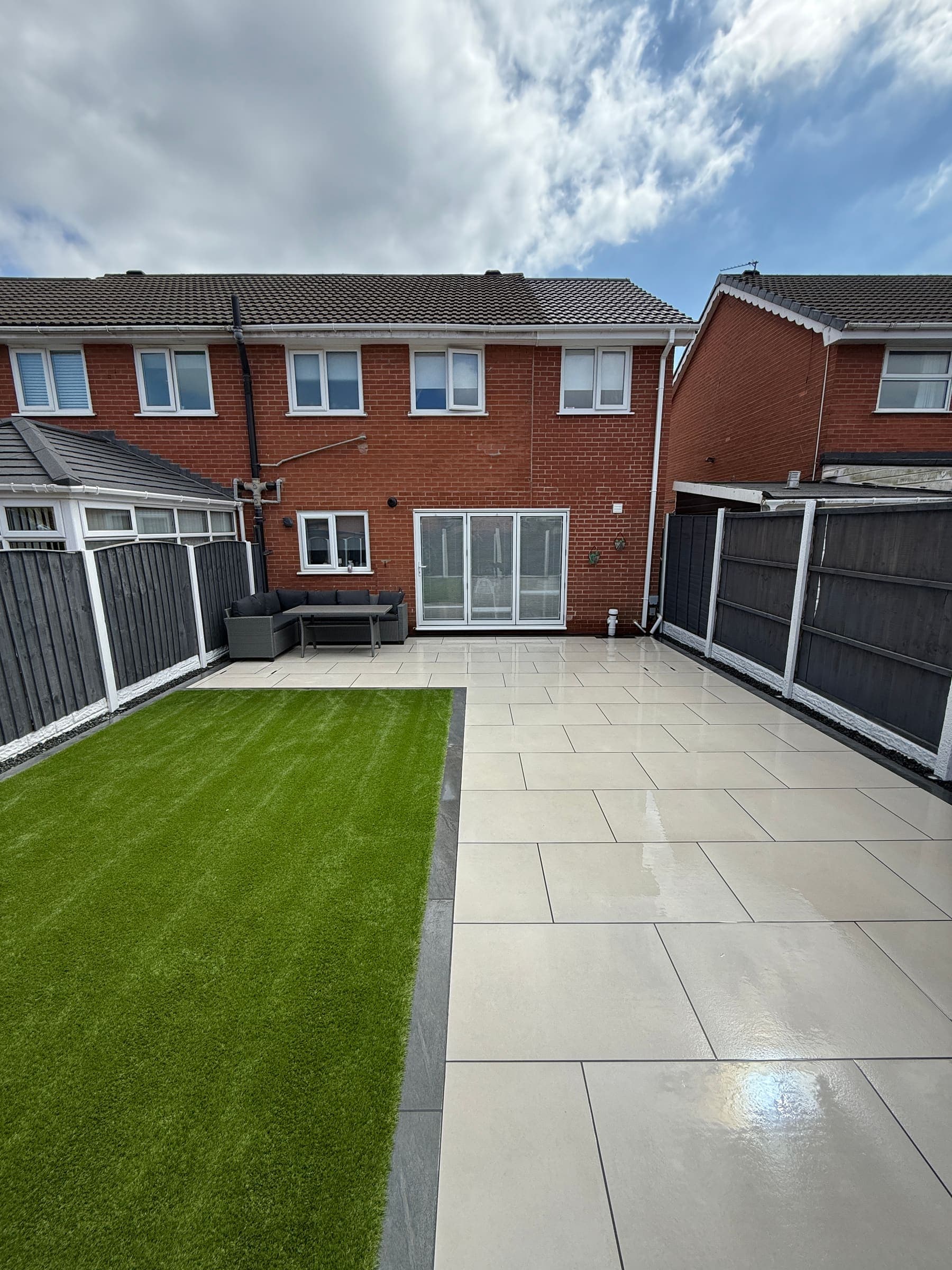 Artificial grass and patio paving in a Liverpool rear garden