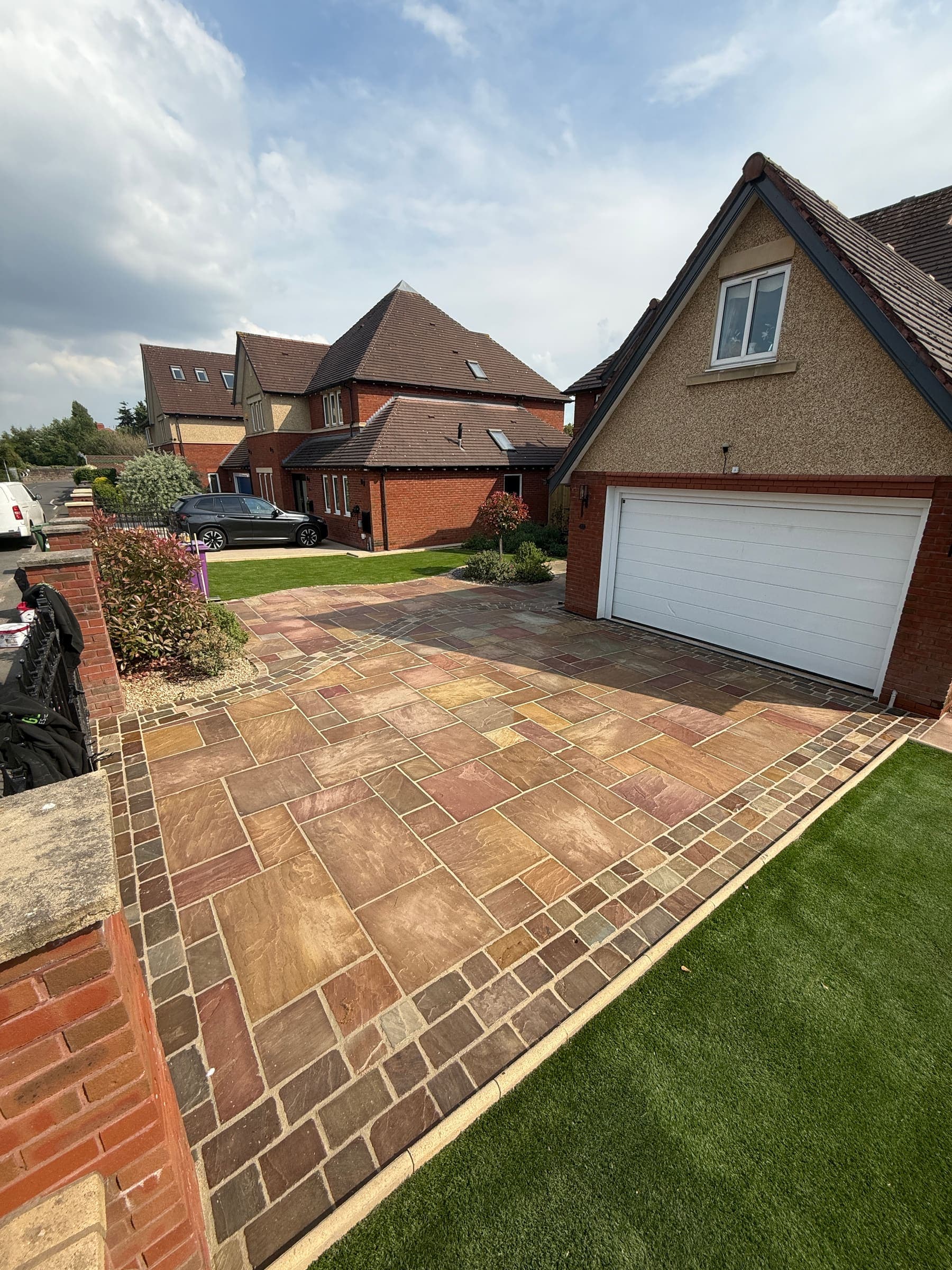 Block paving driveway with decorative edging and drainage at a Liverpool home