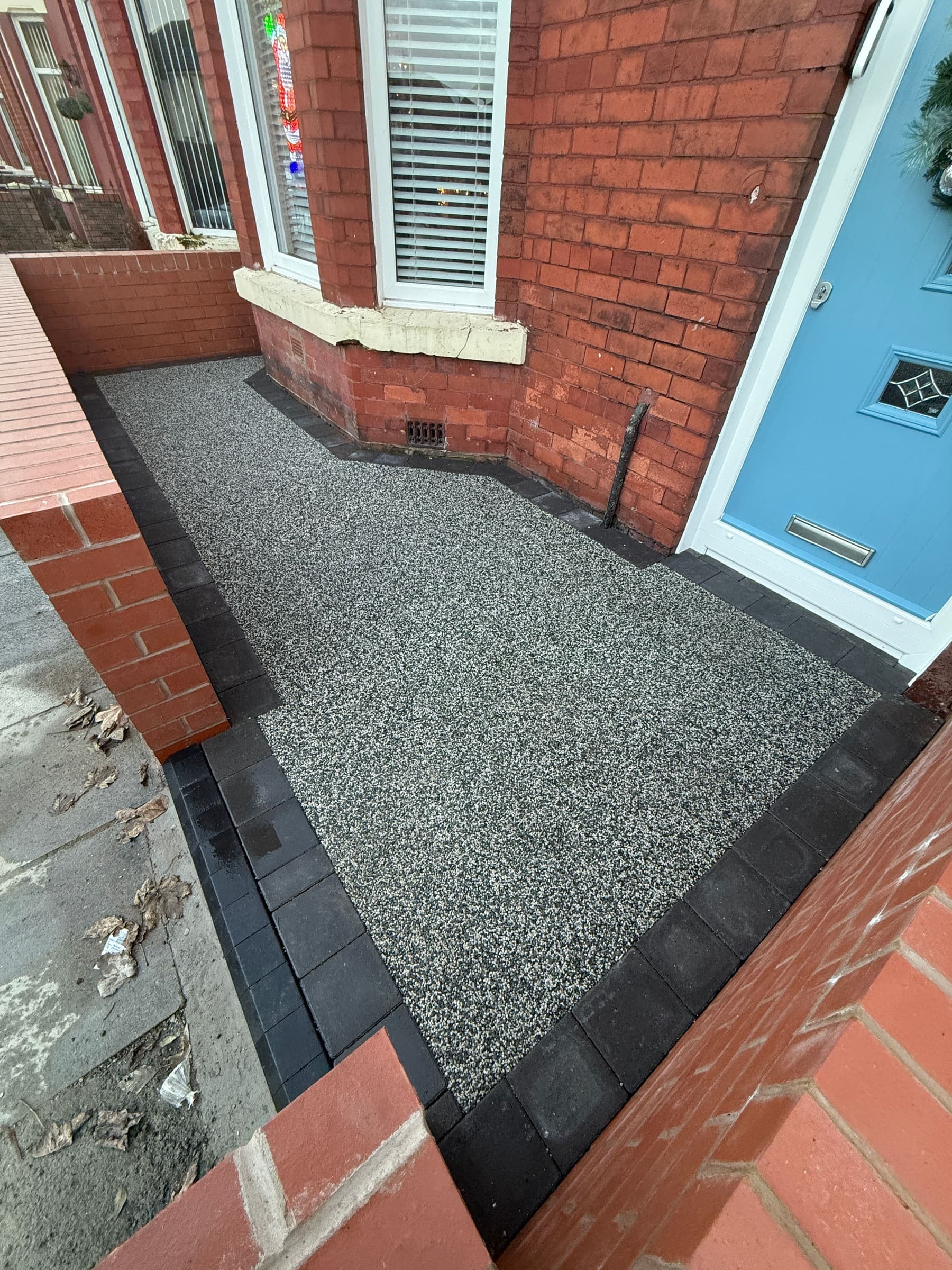 Grey resin bound driveway and front door pathway at a Liverpool home
