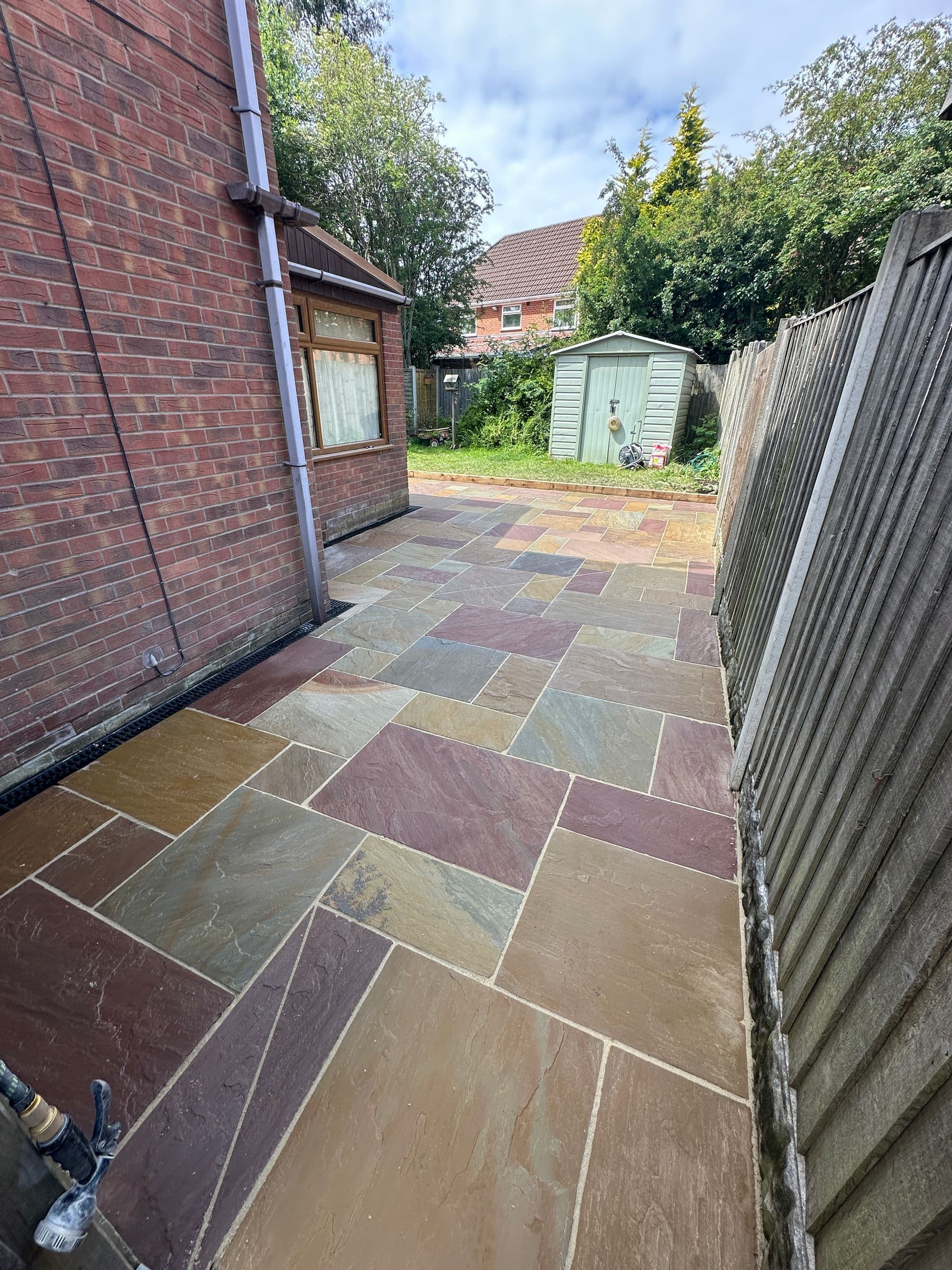 Indian sandstone side patio and garden pathway at a Liverpool property