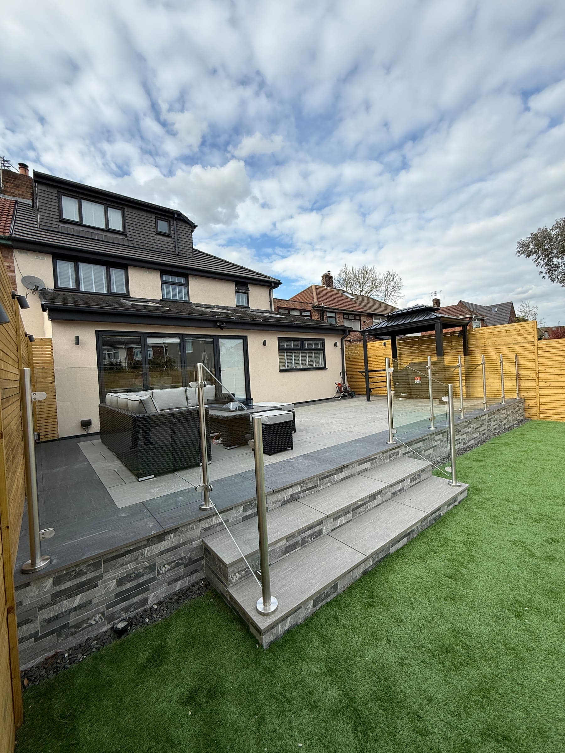 Raised patio in front of a modern garden room in Liverpool