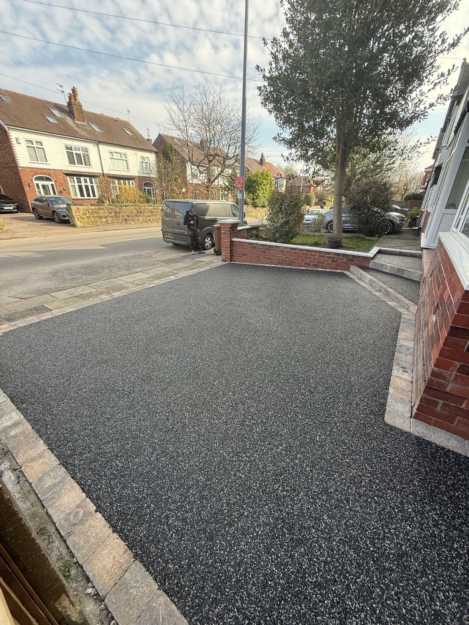 Resin bound driveway with clean edging and a modern finish at a Liverpool home