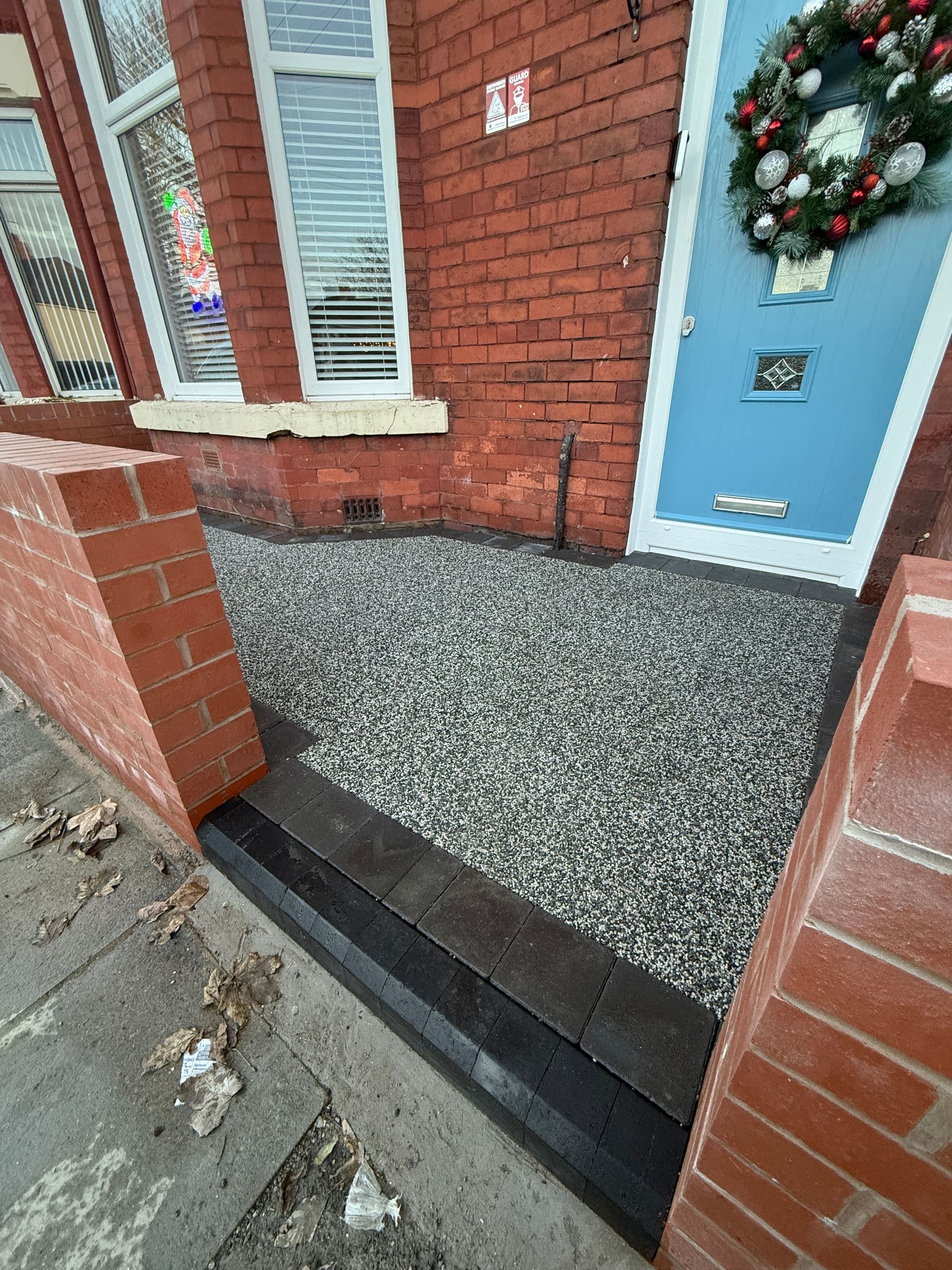 Resin driveway entrance and doorstep pathway at a Liverpool home frontage