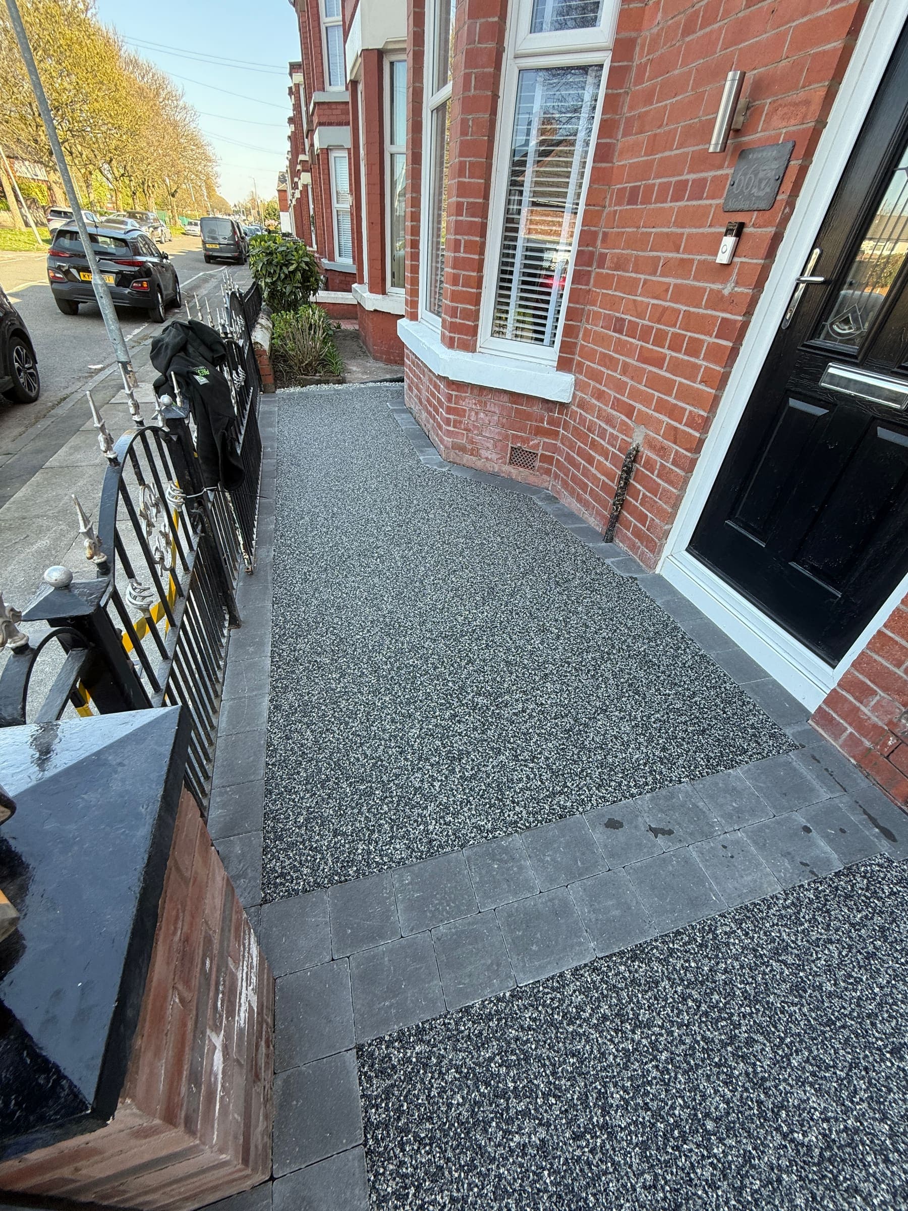 Resin bound driveway and front pathway with metal railings at a Liverpool terrace