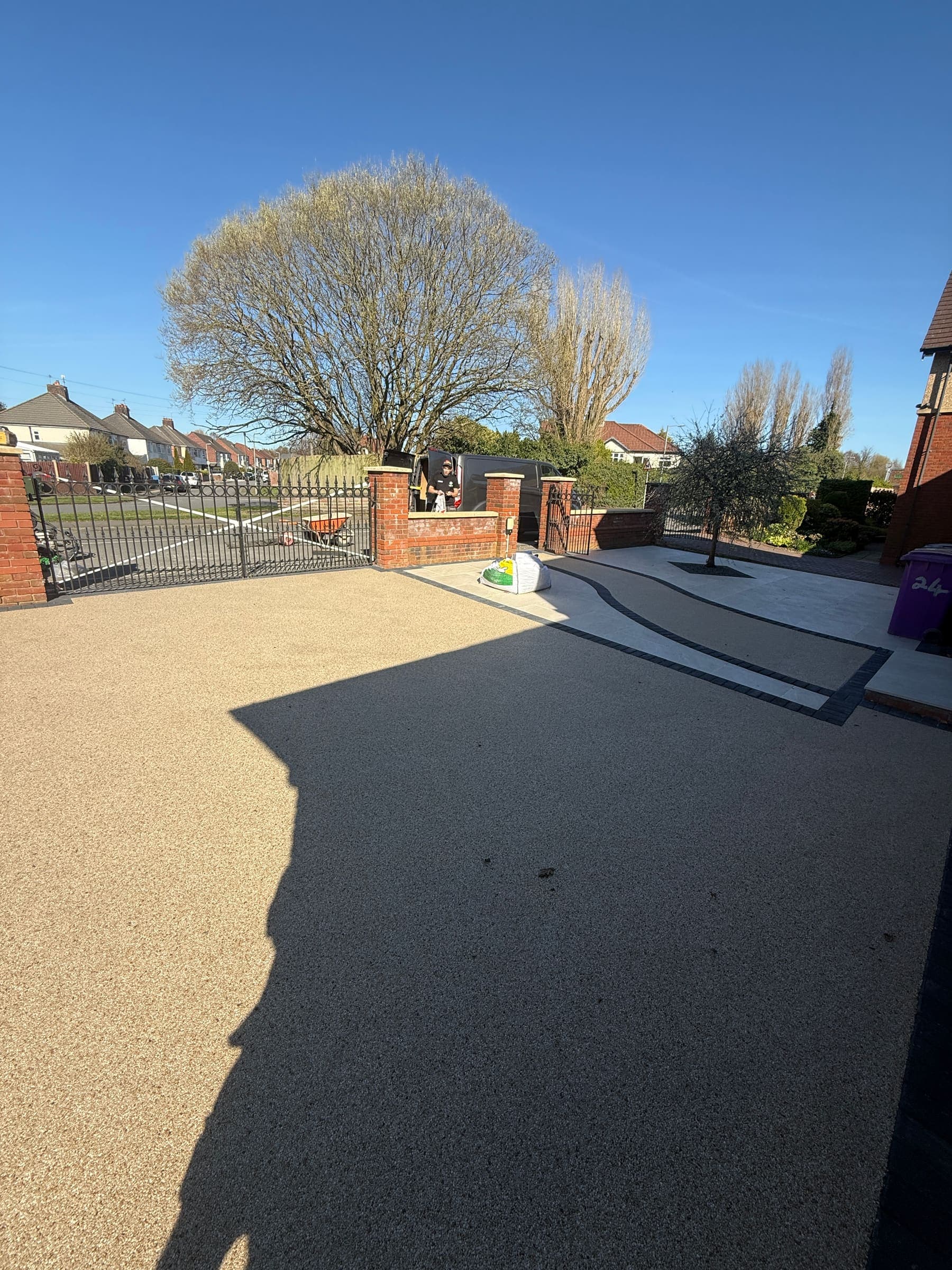 Resin bound driveway leading to a gated entrance and garden frontage in Liverpool