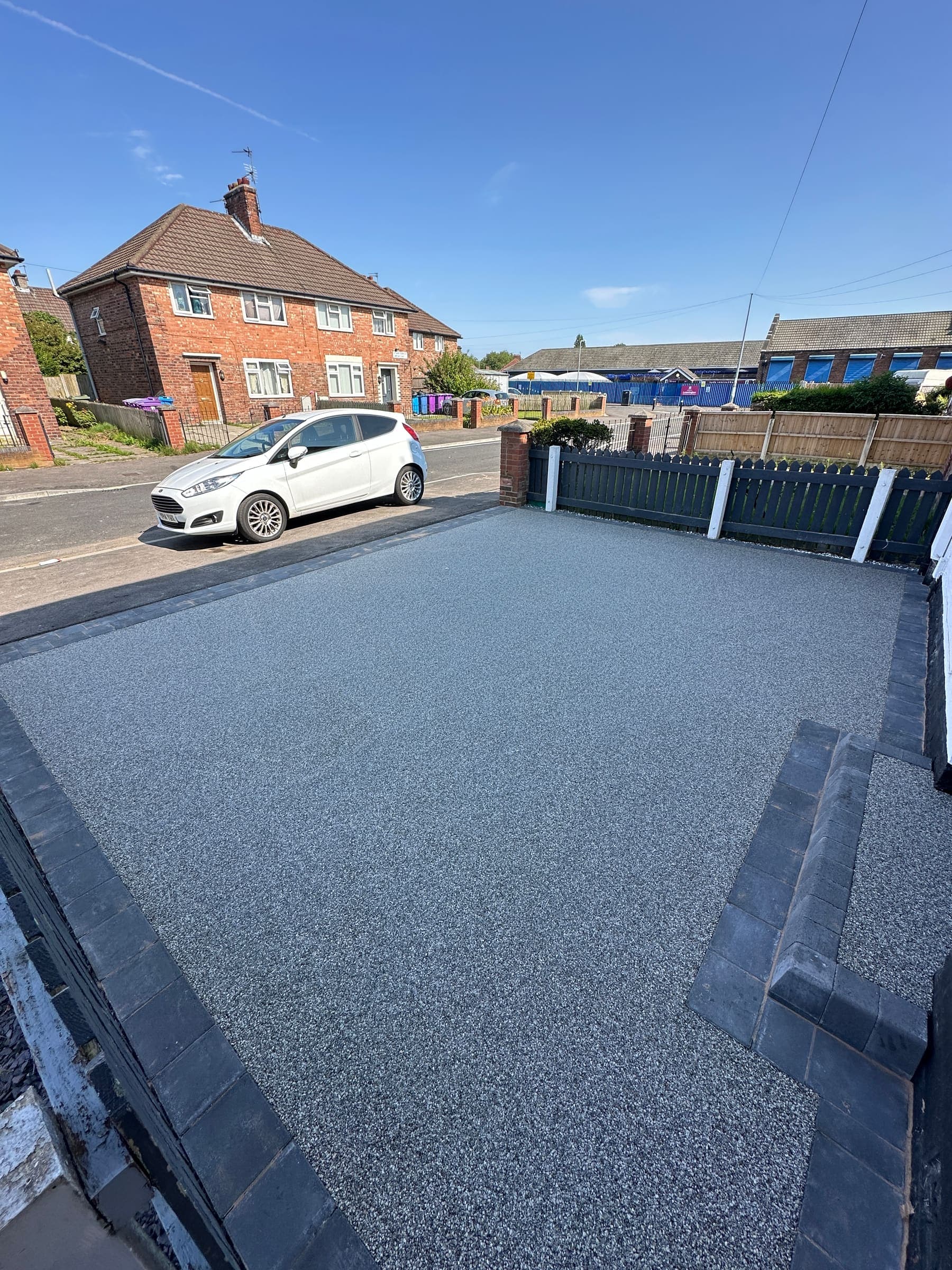 Resin driveway with off-road parking space at a Liverpool home