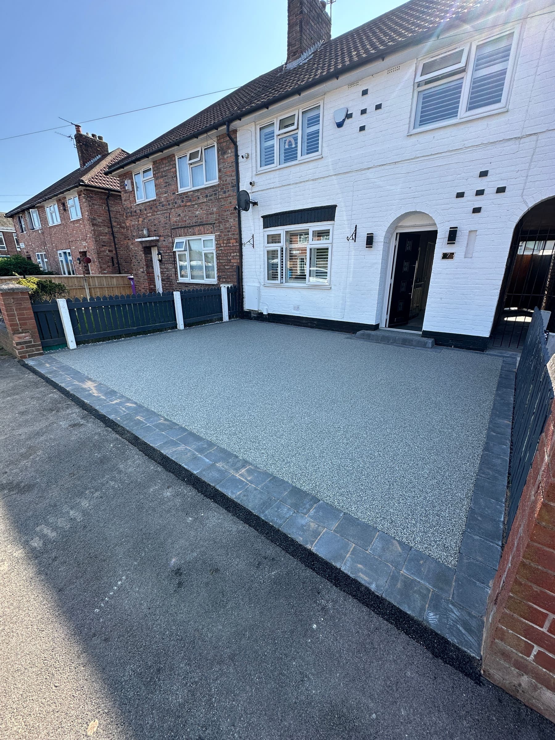 Resin driveway outside a white rendered Liverpool property